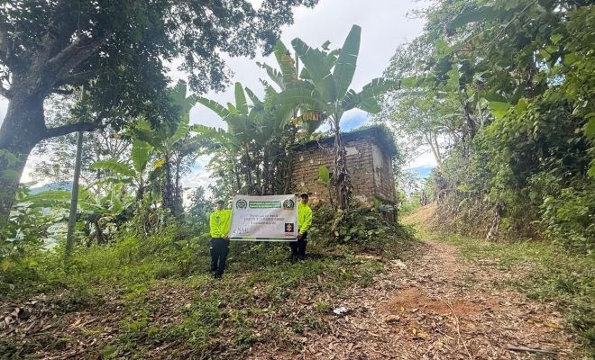 bien inmueble incautado y dos funcionarios de policía judicial