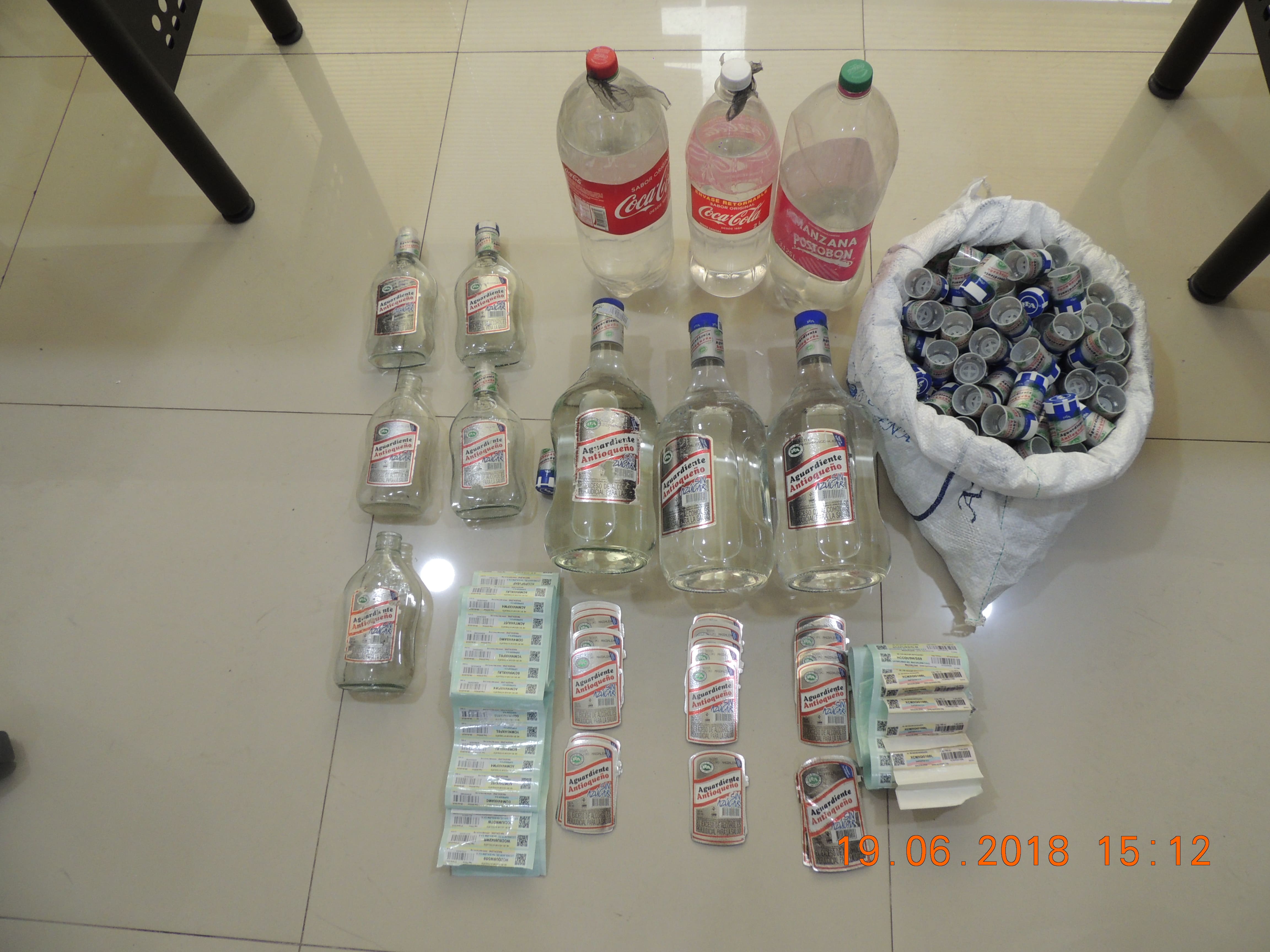Licor adulterado incautados en los allanamientos licor adulterado-botellas y etiquetas incautadas-fundacion-allanamientos-gaula-sijin-magdalena-los caballeros-chimila II